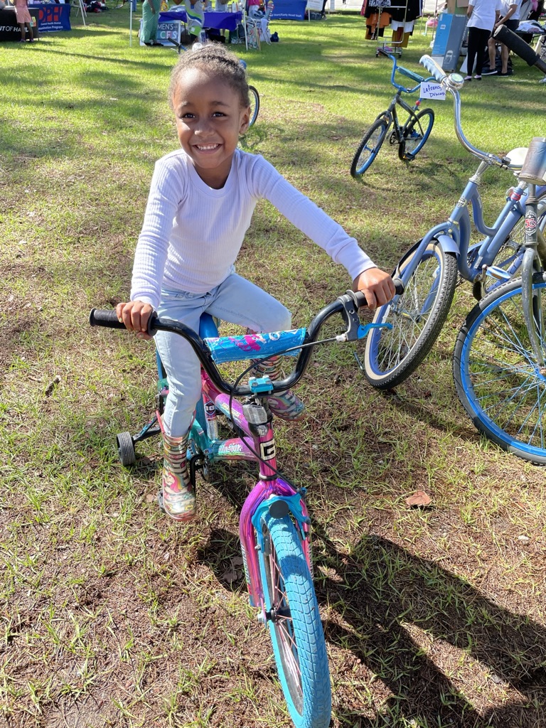 happy child receiving bike